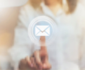 A hand tapping an email icon